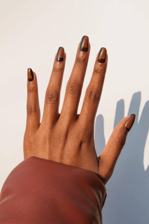 Woman's Hands with polished nails of random colors